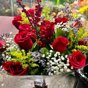 Red roses and red berries bouquet